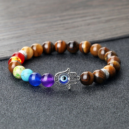 Image de bracelet 7 chakras en pierres naturelles — harmonie, protection et énergie spirituelle avec œil de tigre et main de fatma - bijou méditation et bien-être